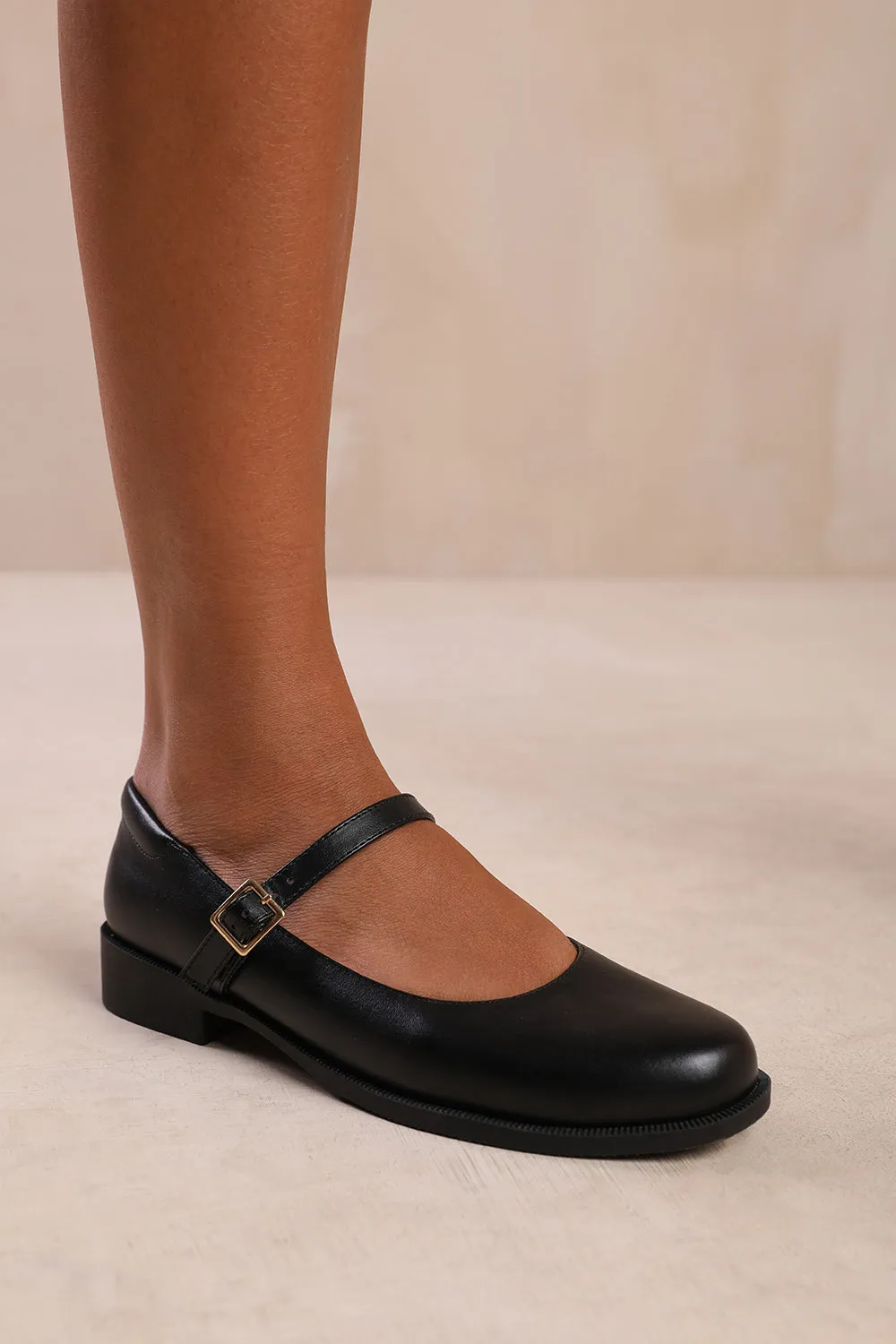 KINGSTON LOW HEEL LOAFER WITH STRAP AND BUCKLE DETAIL IN BLACK FAUX LEATHER